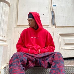 red We're Not Really Strangers hoodie